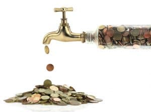 Money coins fall out of the golden tap